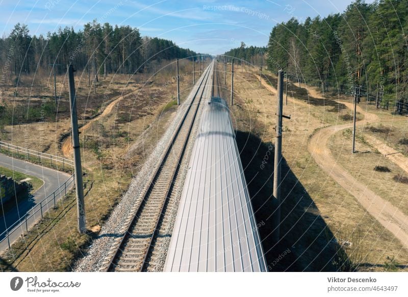 Railway tracks go into perspective in spring latvia baltic parallel summer journey tree sunlight outdoors iron country tourism empty beautiful path high view