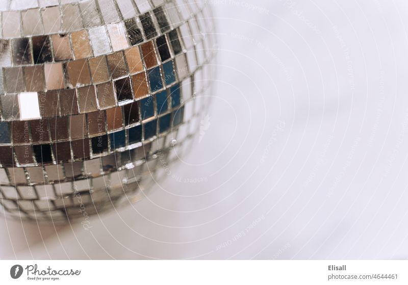 Disco Ball on plain background representing party Disco ball Party concept Mirror mirrorball Space for text