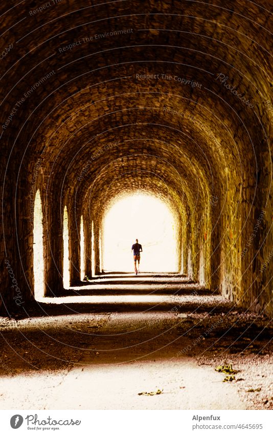 unhanded Tunnel into the light beyond Light Architecture Shadow Human being Loneliness Corridor Fear Building Contrast Passage Light (Natural Phenomenon)