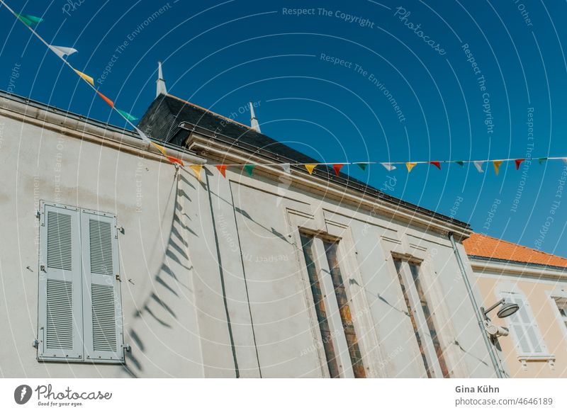 Colorful flags on house wall colorful flags Living in the city exterior view of buildings Decoration Town house (City: Block of flats) house facade