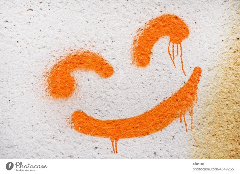 melting orange color of a smileys sprayed on the wall / youth culture / optimism Smiley Orange Wall (building) Graffiti deliquesce Colour Laughter grin bright