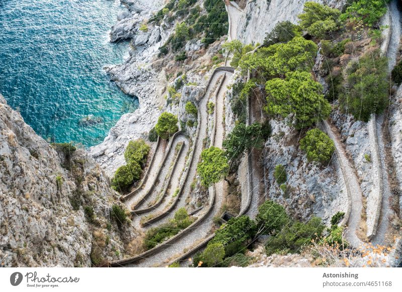back and forth - Via Krupp, Capri path off Landscape down Steep curves Arch Italy Ocean Blue stones trees Nature Green Gray vacation coast Vacation & Travel