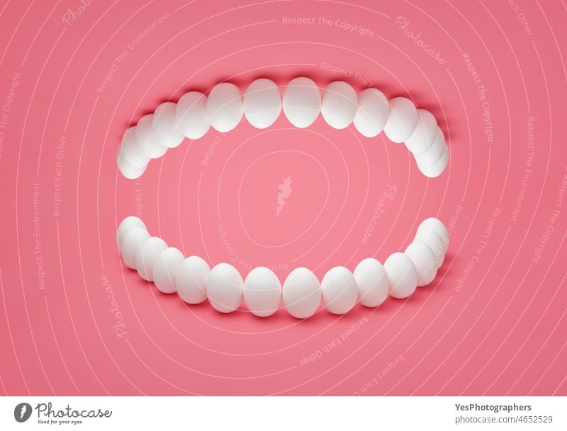 Human denture concept with chicken eggs. Healthy teeth presentation. abstract anatomy artificial background beautiful bleaching calcium care clean clinic