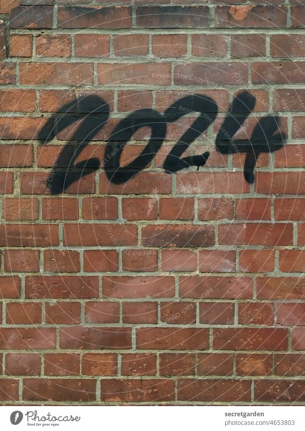 Trendsetting. Graffiti Wall (building) Minimalistic Year date 2024 Fear of the future Future Time Wall (barrier) Brick wall Deserted Colour photo Exterior shot