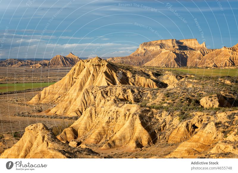 Cliff formations in semi desert area under blue sky nature cliff mountain landscape travel bad land rock majestic scenery rough terrain scenic picturesque
