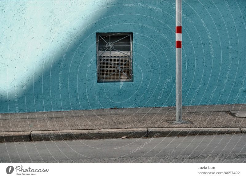 Play of shadows and colors on the roadside Street Roadside Sidewalk off Asphalt Window Grating Cellar window Blue sunny red and white Facade Town Exterior shot