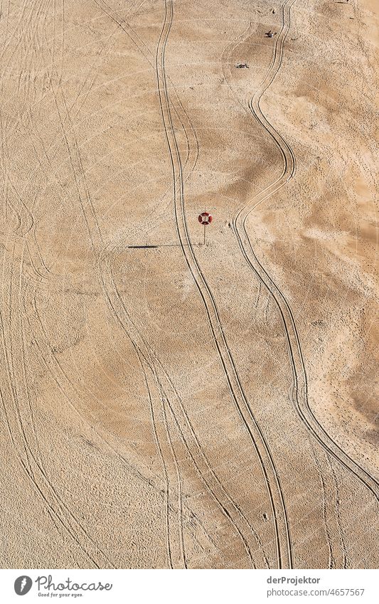 Tracks in the beach in Nazaré in Portugal I Nature Environment abandoned place forsake sb./sth. coast Ocean Emotions Loneliness Gray Gloomy Subdued colour