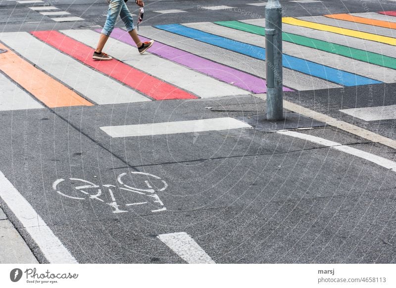 With brisk steps across the rainbow crosswalk. Zebra crossing Prismatic colors Striped Street cycle path Tolerant Traffic infrastructure Pedestrian Asphalt