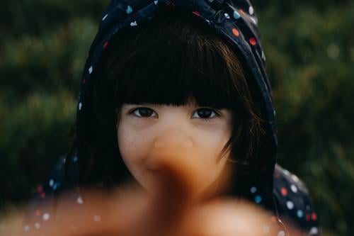 Cute girl looking at camera Girl Child 3 - 8 years Caucasian Eyes Looking into the camera pointing at camera Portrait photograph Infancy Face Human being