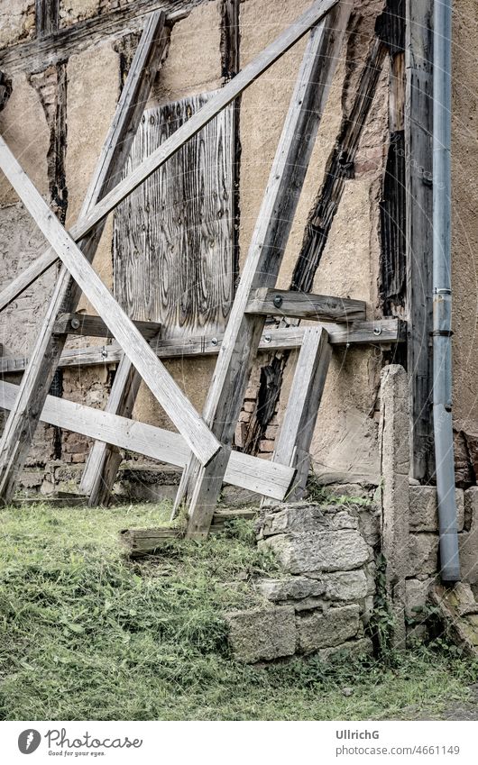 A Dilapidated Half-timbered Structure structure supporting held up construction timber framework half-timbered house architecture edifice corner wall facade