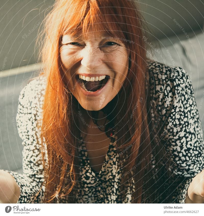 Joy - woman with red long hair laughs with open mouth to camera Long-haired fortunate muck about Face portrait Smiling Joie de vivre (Vitality) Happy brown eyes