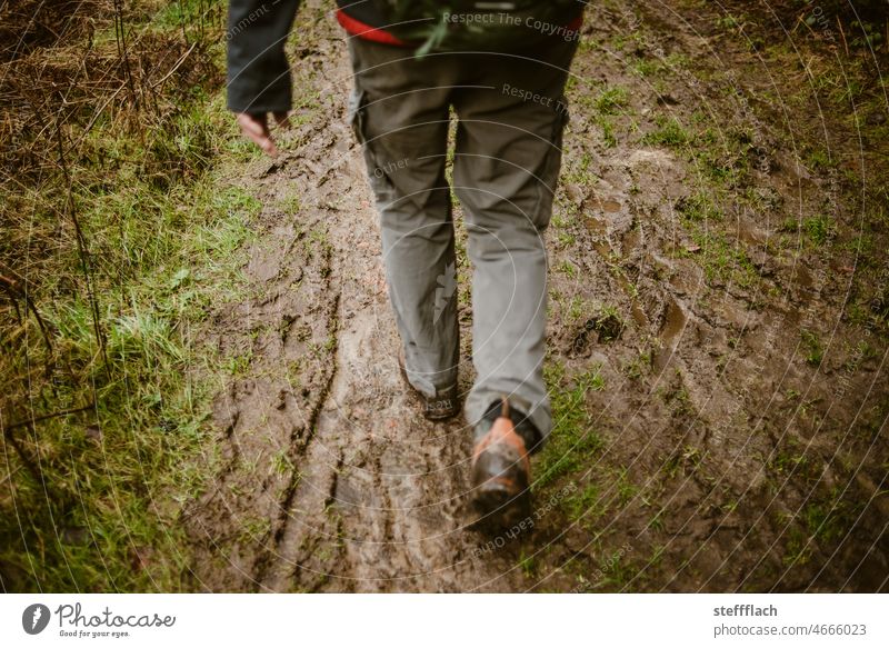 Hike through the mud slush off hike Hiking Hiking boots Pants Backpack Rain Earth Forest forest hike Mud damp earth filth Slick squidgy Sludgy Dirty Dark