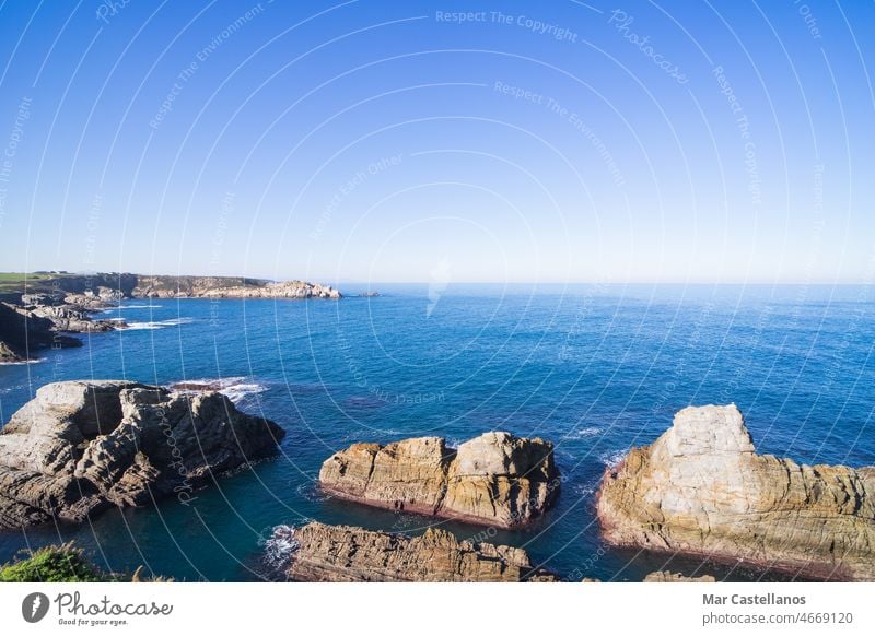 A turquoise sea in waves, to in blacco, a Free copy with lighthouse Royalty Photocase the flat some foreground and vertical, blue Photo - from background a Stock the space