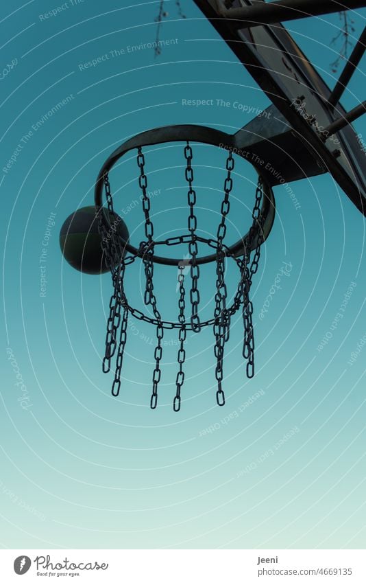 Hit the basketball hoop Basketball Basketball basket Sports Playing Sky Throw Strike Worm's-eye view Ball Jump Metal Target Athletic Blue Leisure and hobbies
