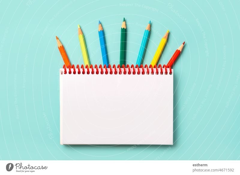 https://www.photocase.com/photos/4671592-spiral-notebook-with-colored-pencils-and-with-space-for-your-picture-or-text-photocase-stock-photo-large.jpeg