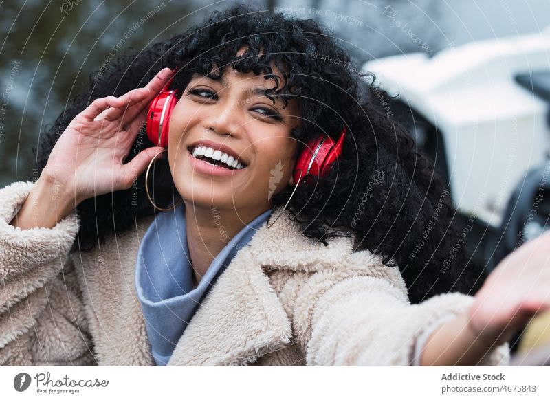 black woman listening to music
