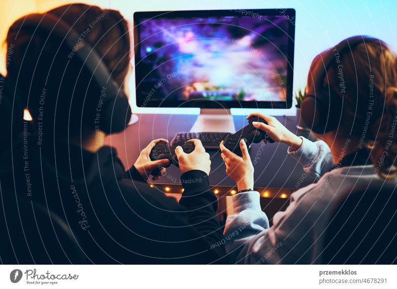 Young gamer play online with friends. Dark scene with gaming PC and lots of  RGB light Stock Photo - Alamy