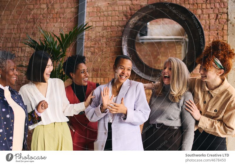 International Women's Day portrait of cheerful multi ethnic mixed age range businesswomen celebrating international womens day iwd empowerment feminist diverse