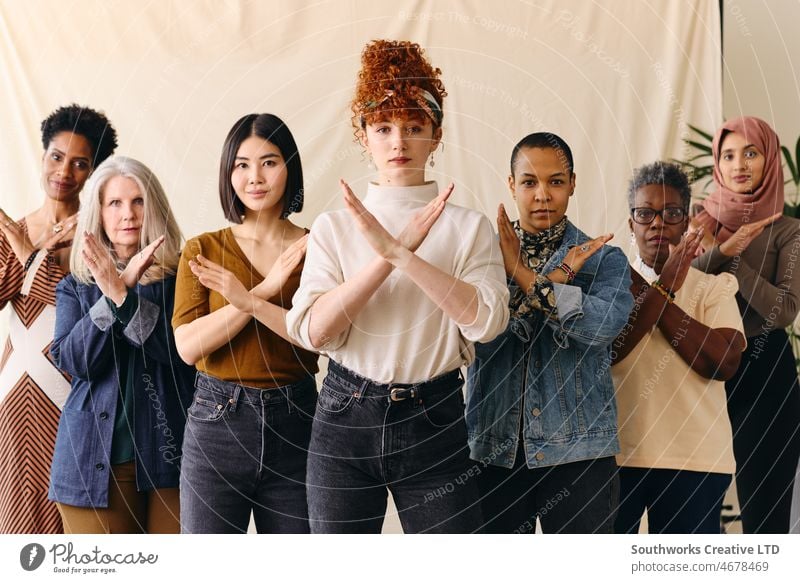Young white woman gesturing Break The Bias in support of International Women's Day with female friends international womens day iwd empowerment feminist