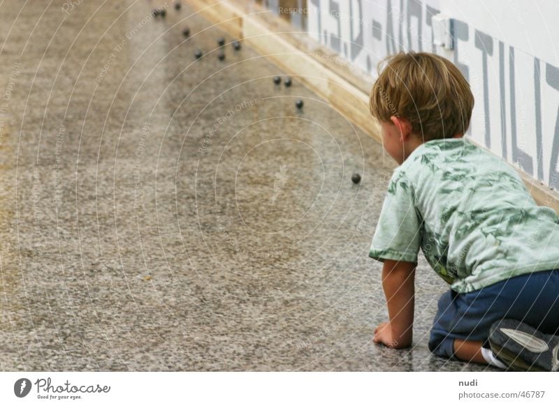 Fascination Sphere Child Boy (child) Playing T-shirt Blonde Wall (building) Venice Joy Floor covering on your knees art biennial boy play fun Rear view