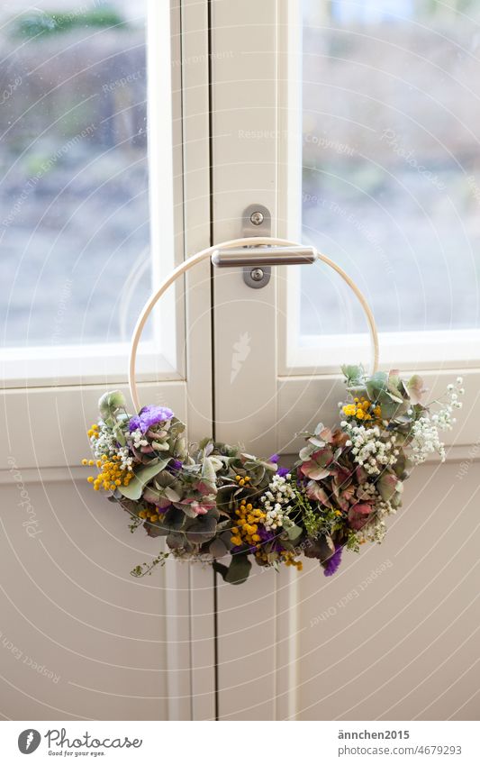 A dried flower wreath hangs on a white door Wreath loop Dried flowers DIY Decoration Interior photos SlowFlowers Interior shot Blossom Spring Colour photo Pink