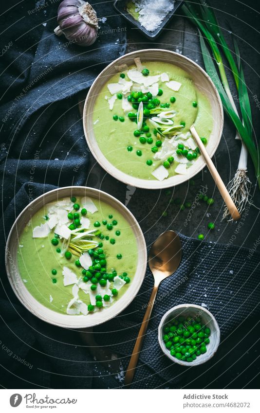 Peas cream on dark table pea soup culinary gastronomy kitchen puree meal healthy food green onion spoon napkin serve nutrition dish fresh ingredient organic