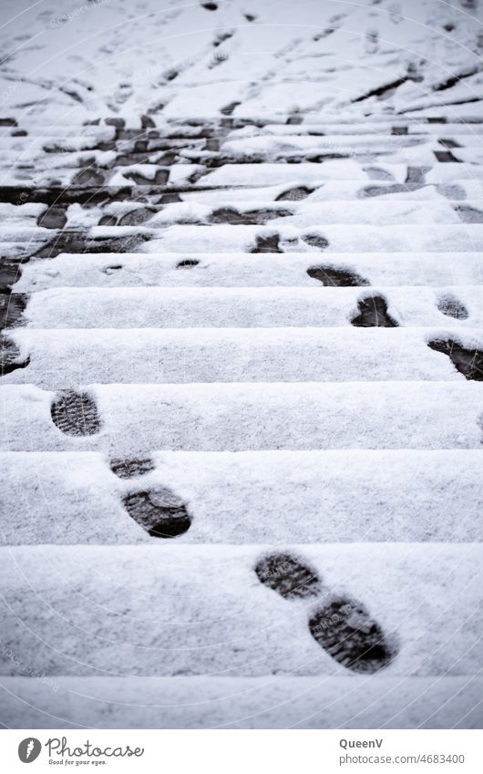 Stairs with snow and footprints stair treads Direction Transport Walking Winter Snow Ramp up climb stairs Ascending shoe sole Tracks Trace off run out