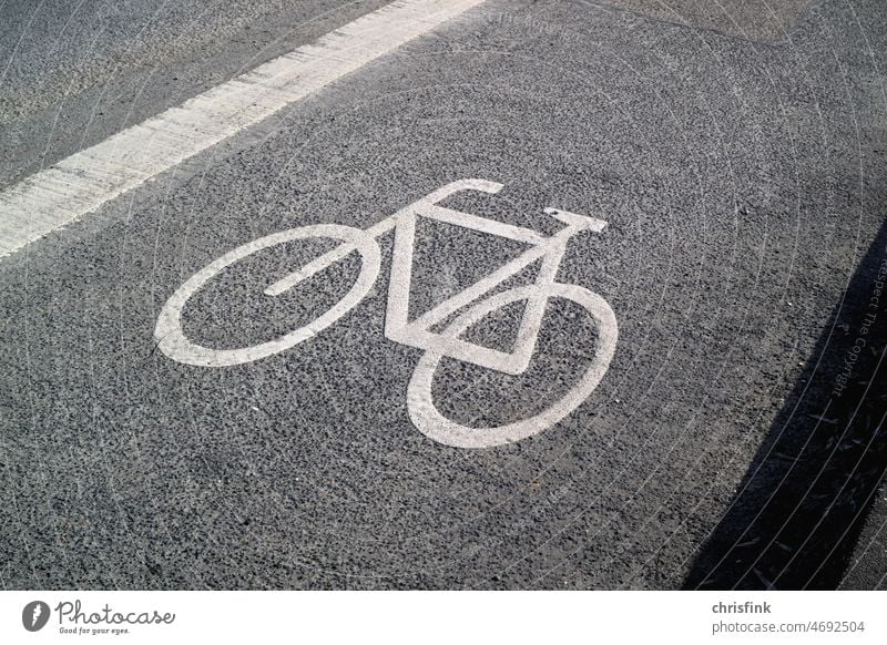 Bicycles marking Wheel cycle path Cycle path Street Asphalt Road marking waypoint eco Environment Energy Lane markings Transport Sports bike Electric bike