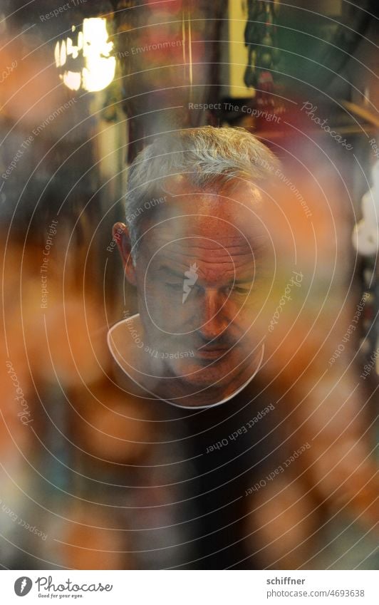 Man in a store middle-aged man from the front Shallow depth of field Store premises business