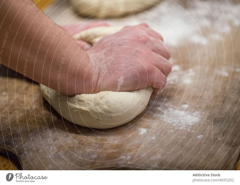 Unrecognizable baker kneading dough in bakery bakehouse kitchen culinary recipe work raw bakeshop uncooked light gastronomy cuisine organic prepare professional