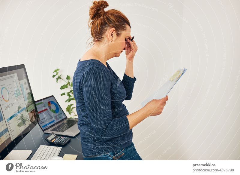 Woman entrepreneur feeling tired and stressed. Puzzled and confused businesswoman thinking hard. Frustrated woman keeping eyes closed focused on solving difficult work