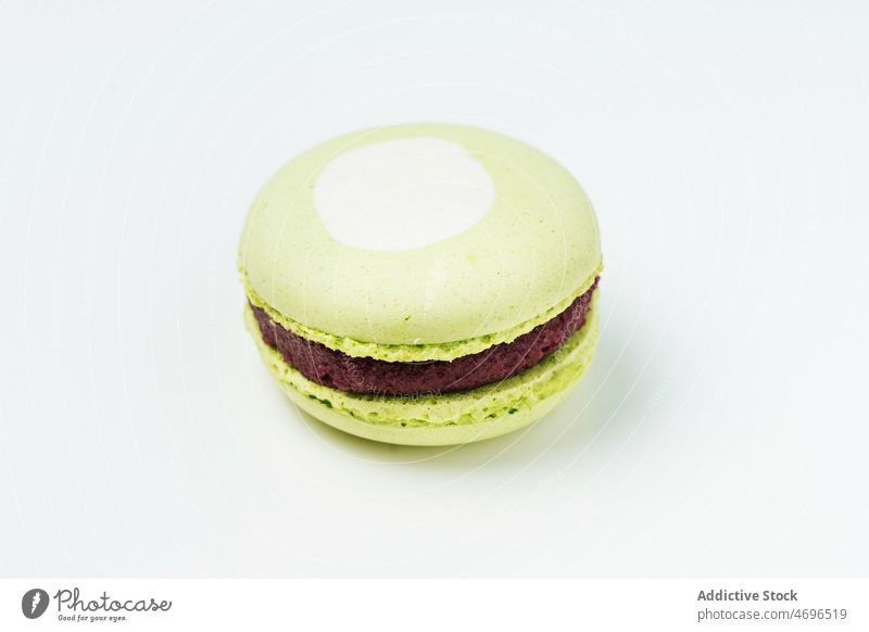 Delicious pistachio macaroon with filling macaron dessert sweet confection confectionery indulge treat food flavor fresh tasty delicious yummy appetizing french
