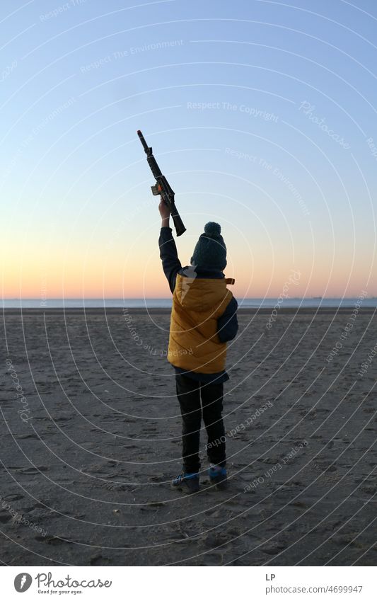 child pointing out a gun towardsthe sky Movement Activism symbol Sign Democracy Support Help Solidarity Peace stand with ukraine Places Blue Yellow Nationality