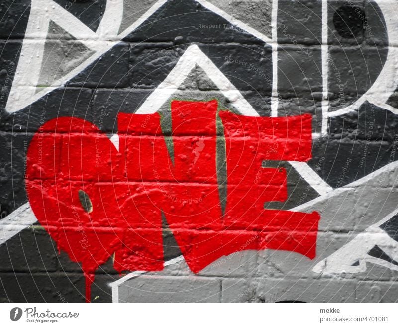 100 + One Graffiti one Red Wall (building) Street art Mural painting Facade Wall (barrier) Youth culture Characters Word Art Lifestyle Creativity Colour colored