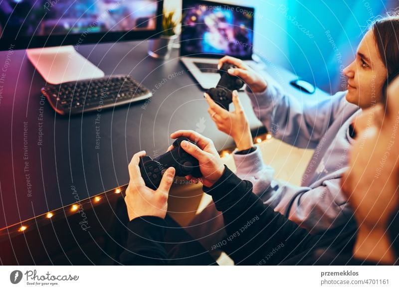 Free Photo  Person playing video games with controller on computer. player  using joystick and wearing headphones to play online game on monitor.  modern man using gaming equipment to have fun.