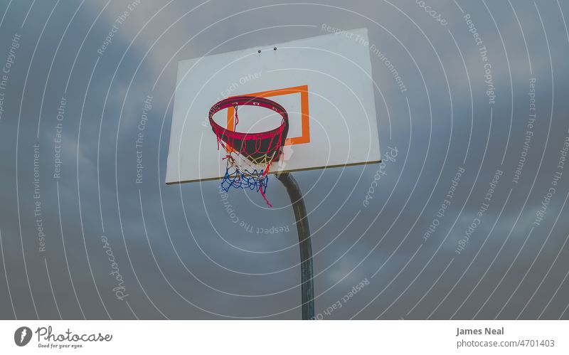 Matte on low angle basketball hoop with moody sky Sports Event Low Angle View Winter Sports Activity Tranquil Scene Backgrounds Basketball Hoop Idyllic