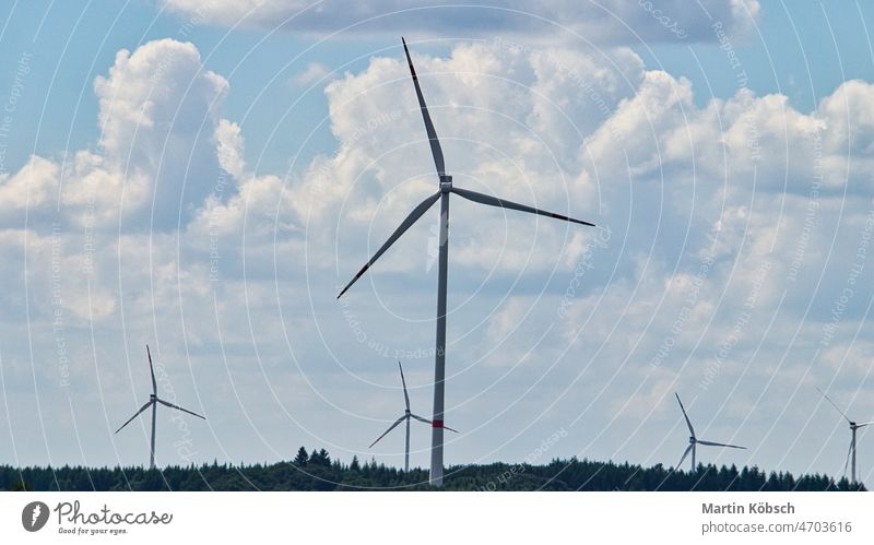 Windmill in foggy landscape. Renewable energy for environmentally conscious future. wind turbine renewable energy nature climate business wind farm electricity