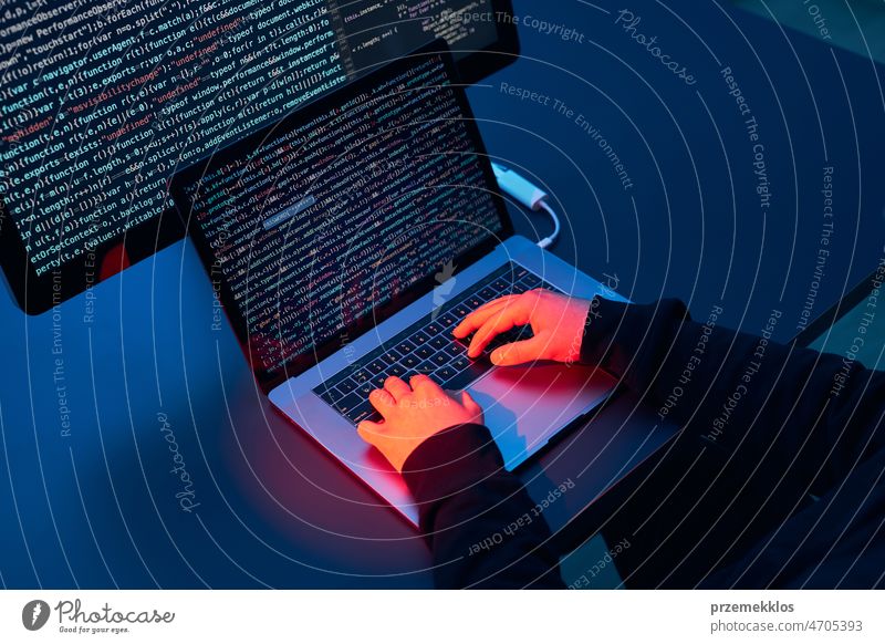 Man using computer and programming  to break code. Cyber security threat. Internet and network security. Stealing private information. Person using technology to steal password and private data