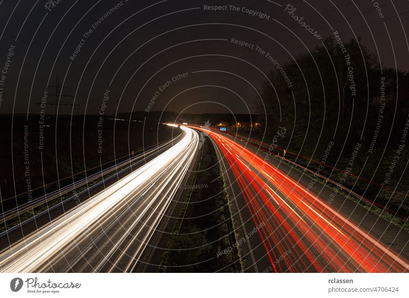 light trails at night on a highway motorway junction dawn auto freeway movement light-trail transportation logistics traffic sunrise street sunset horizon lane