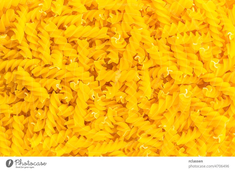 Spiral pasta fussili background texture diet Nutrition eat durum wheat egg noodles Italian Italy carbohydrates food vegetarian raw dough uncooked spaghetti