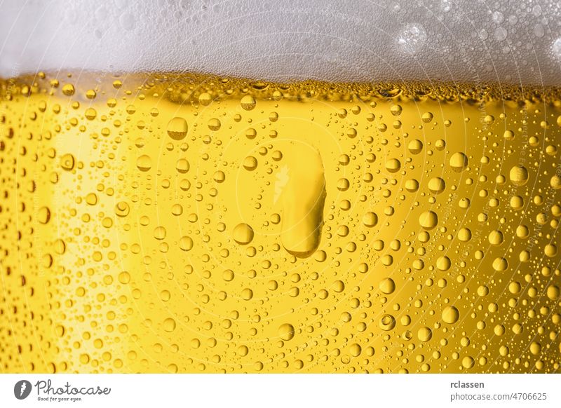 cold german beer with dew drops texture background foam bubble glass gold soda splash surface alcohol alcoholic bar beverage brewed brewery concept droplet