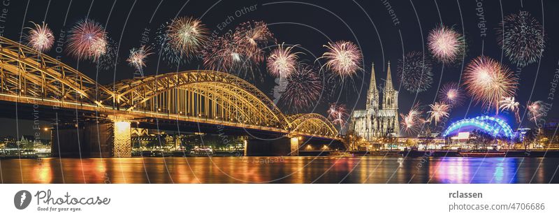 Cologne Cathedral and Hohenzollern Bridge with Fireworks on New Year day, Cologne, Germany cologne fireworks germany rhine new year celebration christmas europe