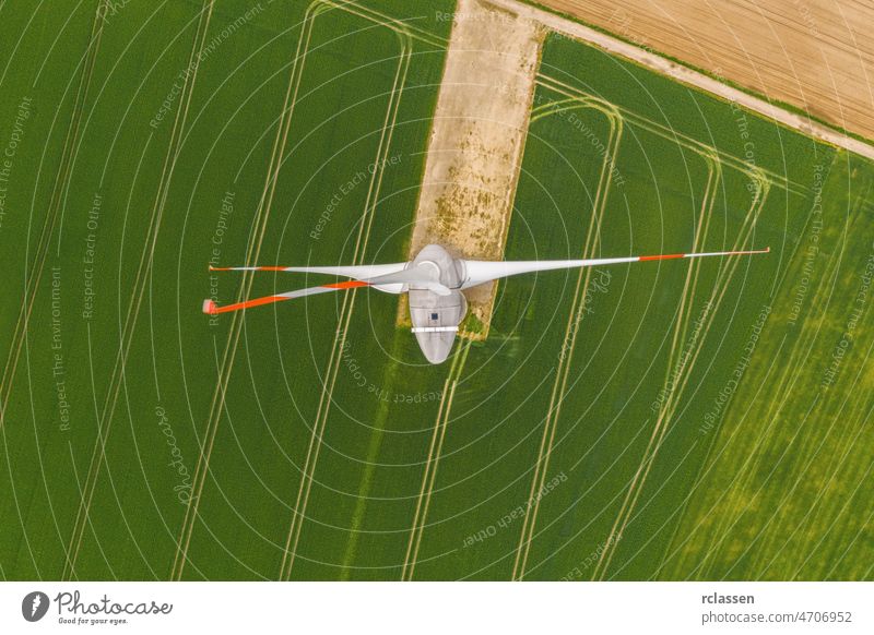 Aerial top down picture of wind turbine a device that converts the wind's kinetic energy into electrical energy providing renewable energy sustainable energy into the electricity grid