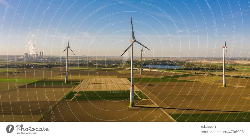 Wind turbine with coal power plant view from drone - environment friendly, renewable energy concept - copyspace for your individual text wind fuel alternative