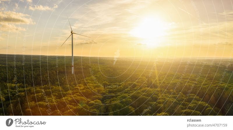 Wind Turbine in the sunset seen from an aerial view - Energy Production with clean and Renewable Energy wind turbine energy power environment fuel alternative