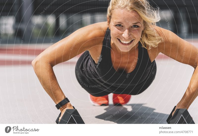 Cross training. Young woman exercising with dumbbells - a Royalty Free Stock  Photo from Photocase