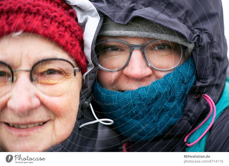 Mother and daughter in winter relation Daughter Family & Relations portrait faces Close-up Winter Cap Hooded (clothing) Cold cold season cold temperature