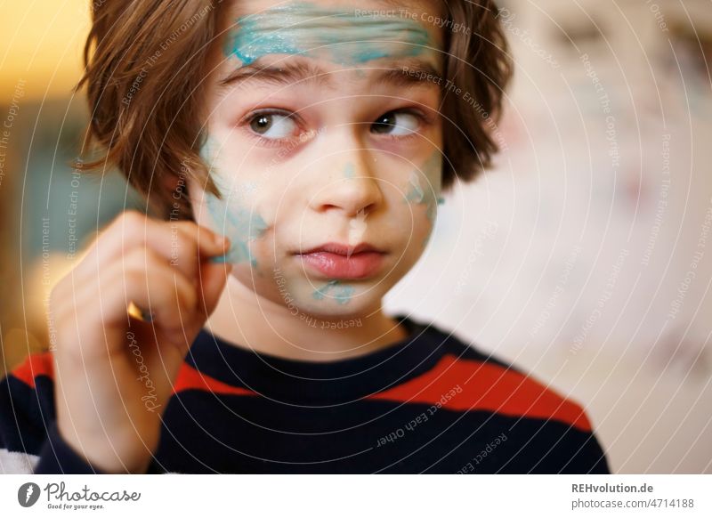 Child removes a face mask from the face Infancy Boy (child) relaxation Beauty & Beauty Mask Face Personal hygiene Relaxation pretty portrait Colour photo