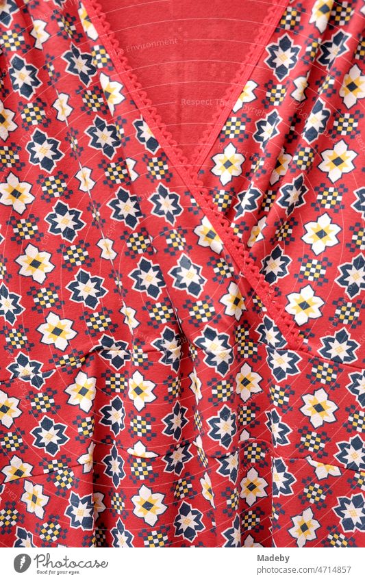Light red summer dress with floral pattern in the style of the fifties and sixties in the summer at the flea market at the Golden Oldies in Wettenberg Krofdorf-Gleiberg near Giessen in Hesse