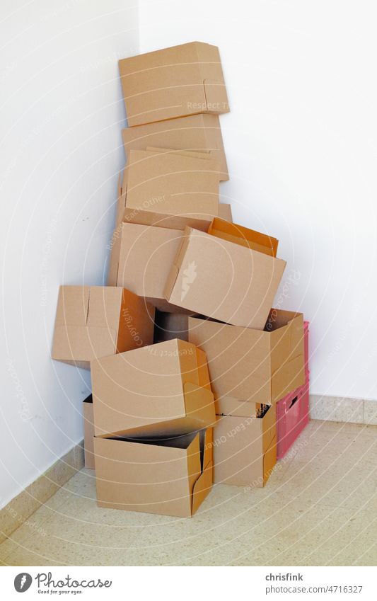 Cardboard boxes placed untidily in corner cardboard box Crate Packaging Packaging material Interior shot Moving (to change residence) Package Logistics Delivery